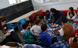Student teachers reviewing a lesson with their tutor